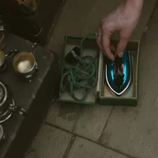 a person is holding a mouse in a box related to The Ultimate Guide to Choosing Bed Bath & Beyond Irons: What You Need to Know