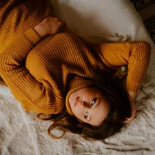a person lying on a bed related to Cozy Dreams for Little Ones