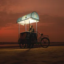 a person riding a bicycle with an umbrella on the back related to The Ultimate Guide to Pedicraft Canopy Beds: Where Function Meets Fantasy