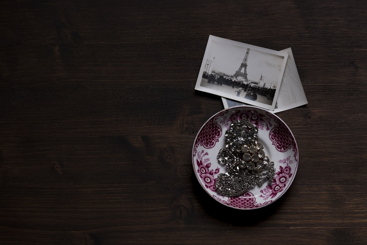 a plate with a picture of the eiffel tower on it related to Bringing French Charm to Your Home: The Art of French Country Curtains Valances