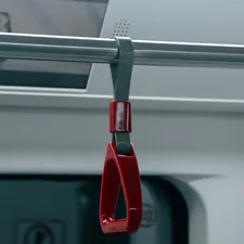 a red pair of scissors hanging from a rail related to The Ultimate Guide to Choosing the Best Bed Assist Handle