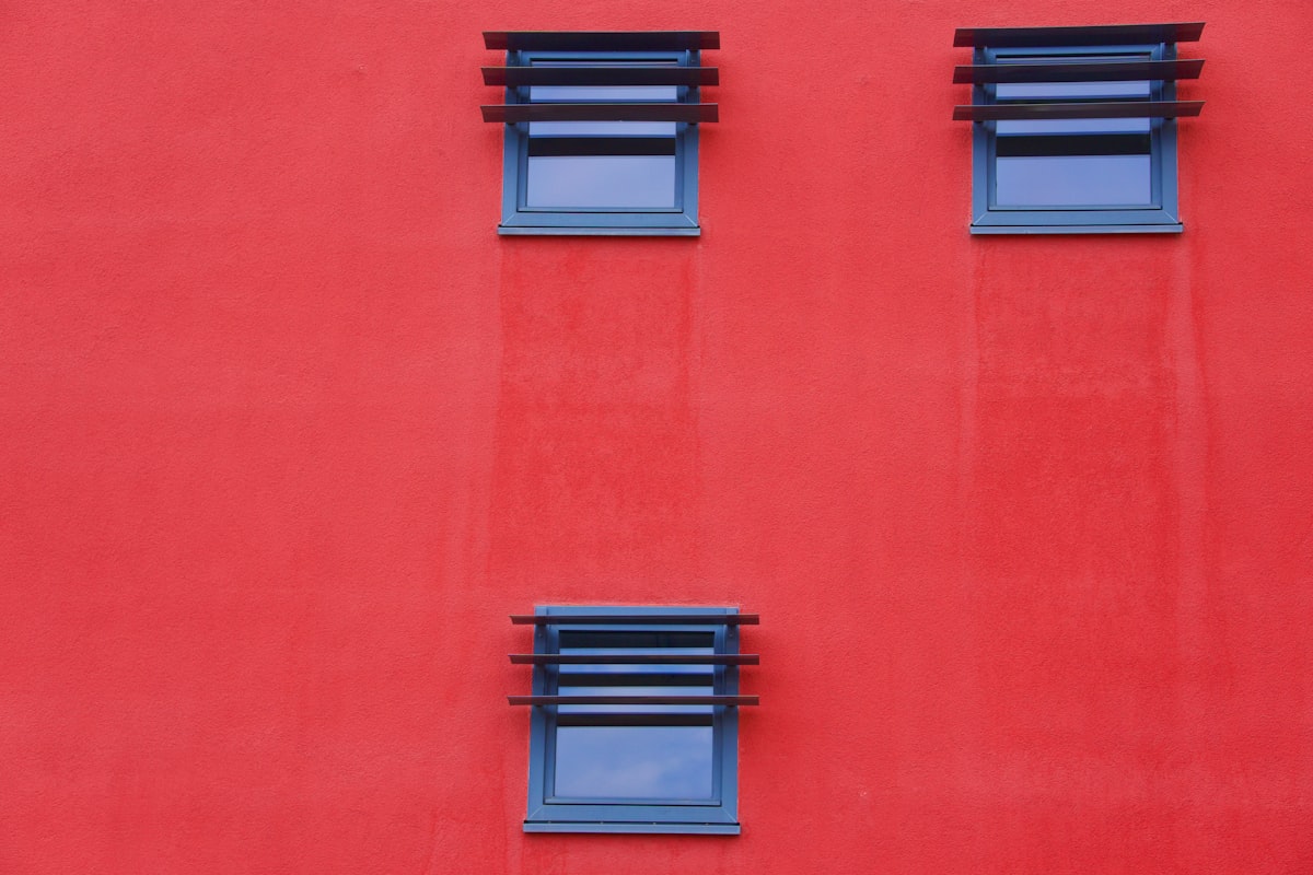 a red wall with blue windows related to Red Window Valances: Elevate Your Home Decor