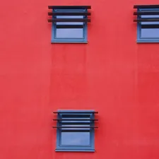 a red wall with blue windows related to Red Window Valances: Elevate Your Home Decor