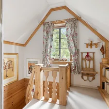 A room with a bed, dresser, and a window related to Pottery Barn Kids Loft Bed: A Comprehensive Guide