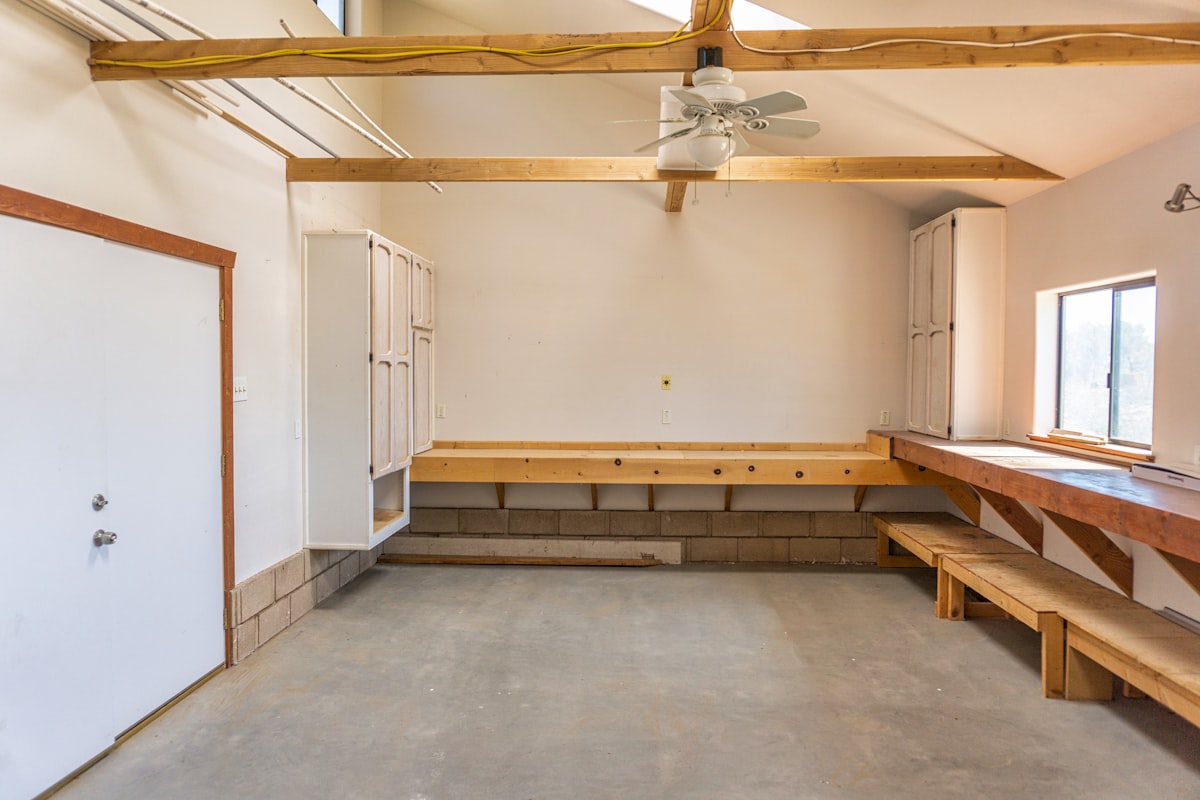 a room with a bench and a fan related to Elevate Your Home's First Impression with Entryway Bench Pottery Barn