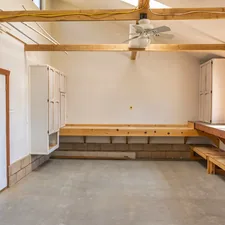 a room with a bench and a fan related to Elevate Your Home's First Impression with Entryway Bench Pottery Barn