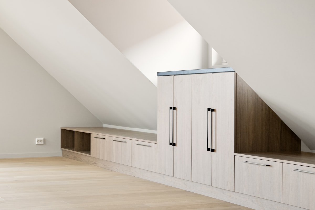 A room with a lot of cabinets in it related to Unlocking Space Efficiency with Murphy Bed Cabinets
