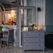 a room with a table and chairs related to Small Mirrored Sideboards for Compact Spaces
