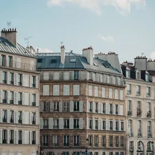 a row of buildings with balconies and windows related to Discover the Elegance and Comfort of Paris Twin Bedding