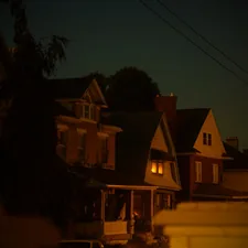 a row of houses lit up at night related to Cozy Retreats: The Best Romantic Bed and Breakfast Ohio Has to Offer