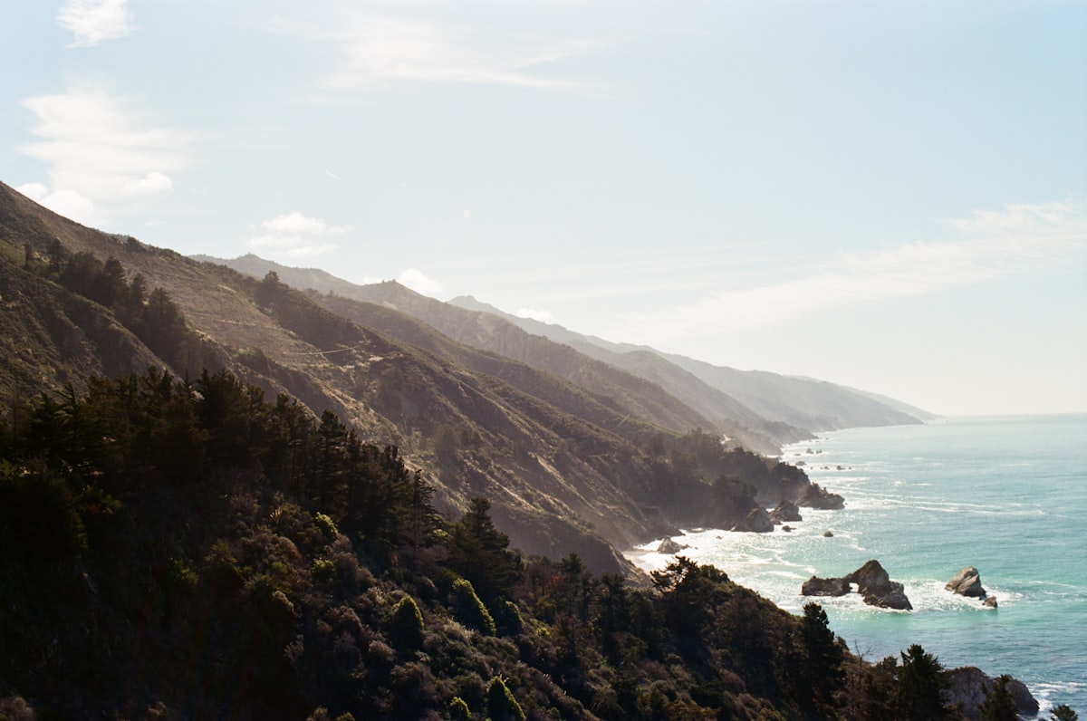 a scenic view of the ocean and mountains related to Escape to Serenity: Discover the Best Big Sur Bed and Breakfasts