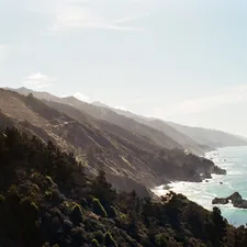 a scenic view of the ocean and mountains related to Escape to Serenity: Discover the Best Big Sur Bed and Breakfasts
