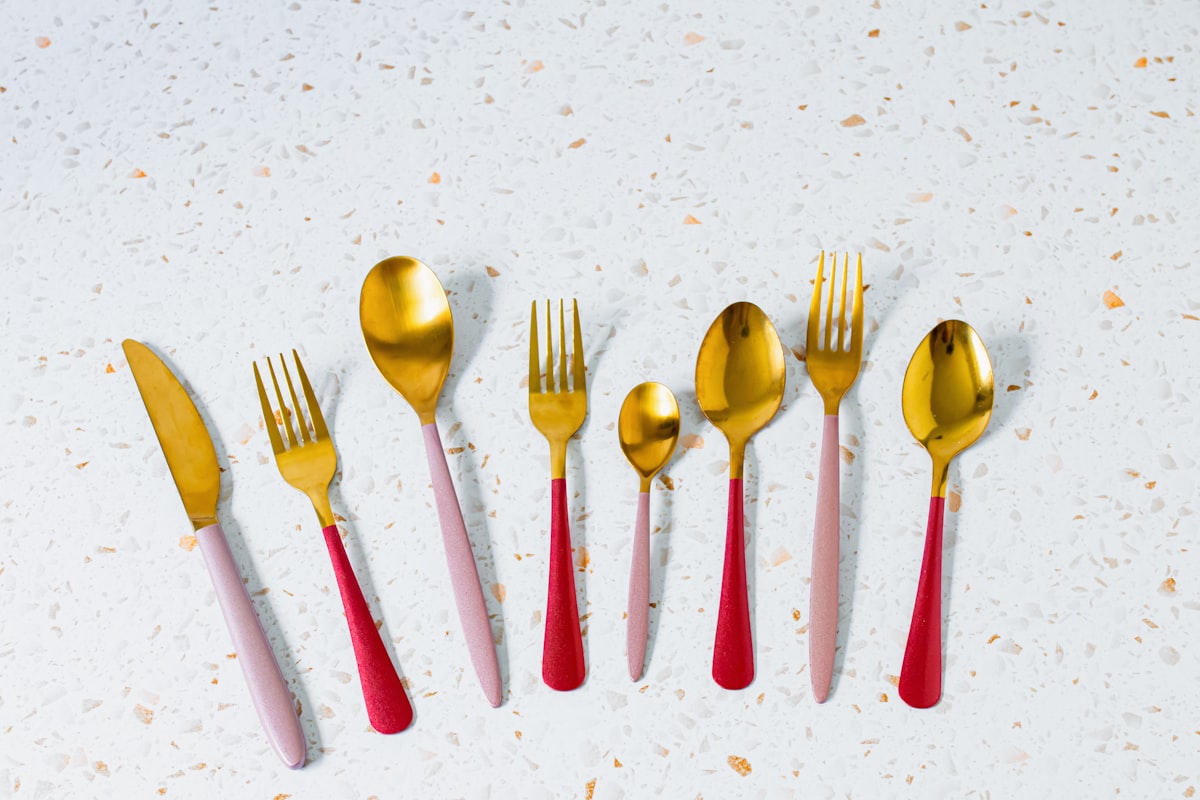 a set of five gold and red forks and spoons related to Stylish Red Kitchen Valances to Brighten Your Space