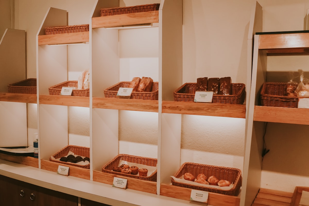 a shelf filled with lots of different types of pastries related to Exploring the Right Space for Bread in Your Home: Bed Bath & Beyond Bread Box Options