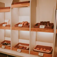 a shelf filled with lots of different types of pastries related to Exploring the Right Space for Bread in Your Home: Bed Bath & Beyond Bread Box Options