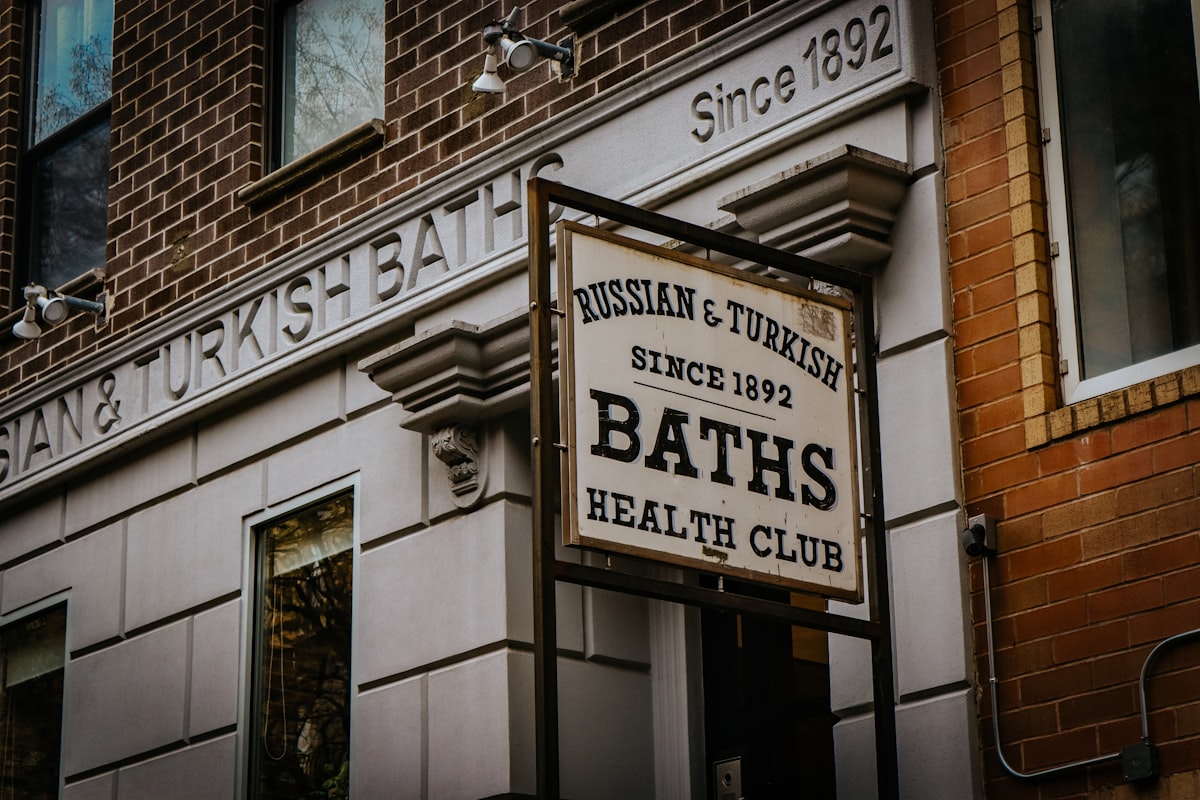 a sign on the side of a building that says bath's health club related to Know Your Bed Bath & Beyond Hours: Guide to Store Hours and Locations