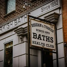 a sign on the side of a building that says bath's health club related to Know Your Bed Bath & Beyond Hours: Guide to Store Hours and Locations