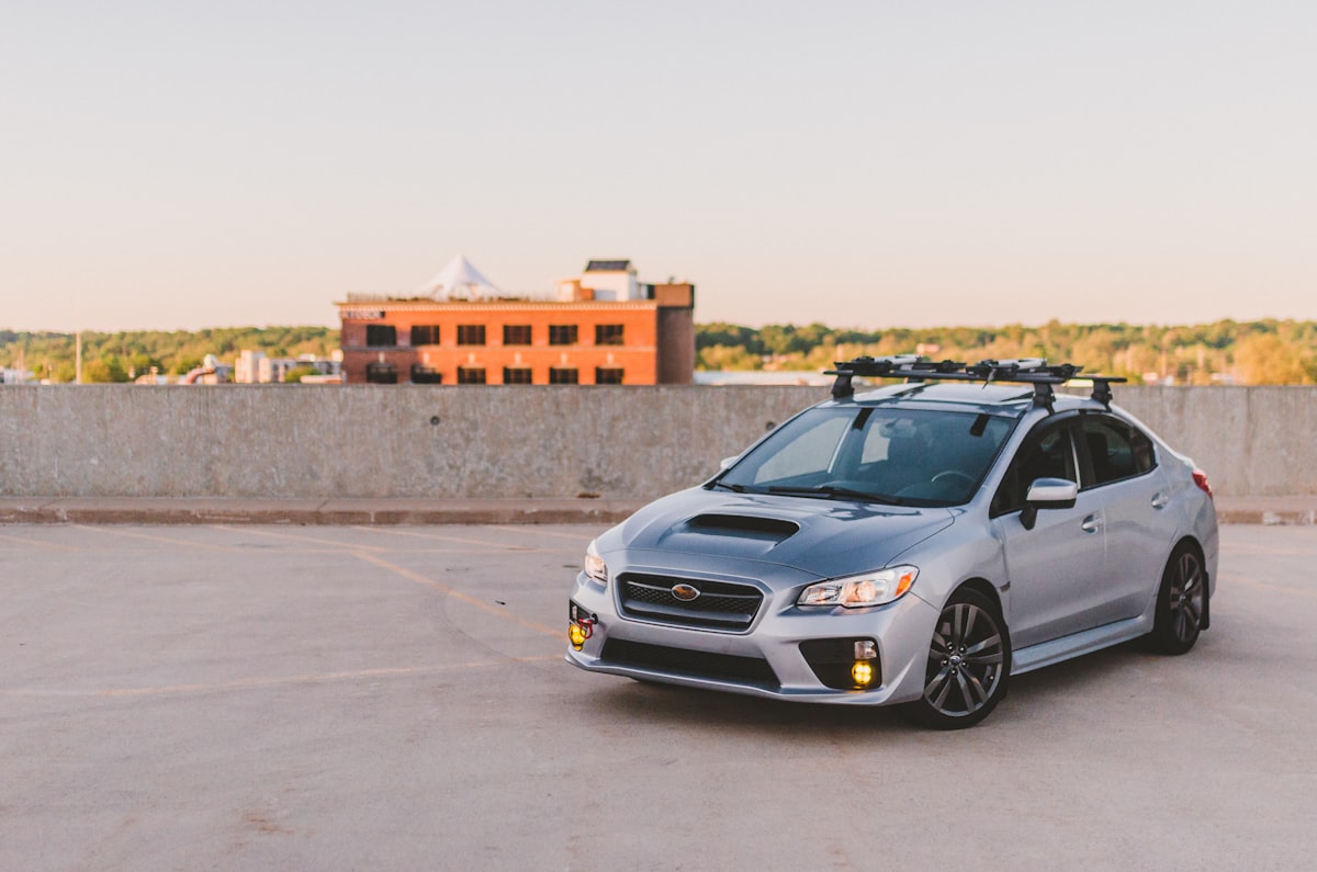 a silver subarunt parked in a parking lot related to Exploring the Versatility of Subaru with a Truck Bed