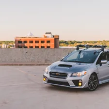 a silver subarunt parked in a parking lot related to Exploring the Versatility of Subaru with a Truck Bed