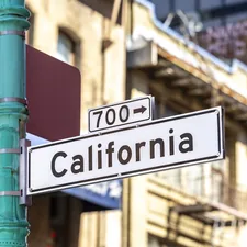 A street sign for california street with building background. related to Exploring the Dimensions of a California King Size Bed