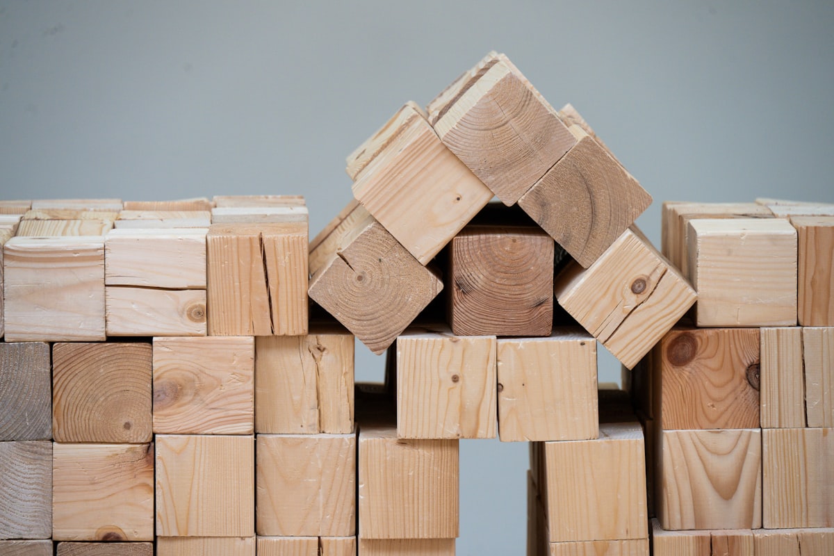 A structure made of wooden blocks resembling a house. related to How to Build a Raised Flower Bed: A Step-by-Step Guide