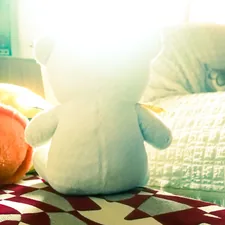 a stuffed animal sitting on top of a bed related to Toys R Us Child Bed: A Dream Come True for Kids
