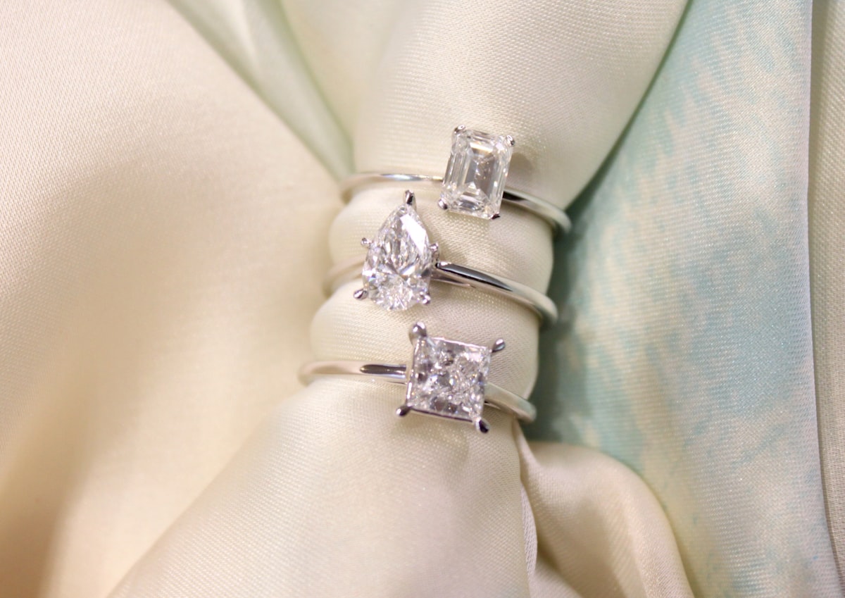 A stunning stack of solitaire diamond engagement rings in white gold. related to Organize Your Treasures: The Ultimate Guide to Bed Bath and Beyond Jewelry Boxes