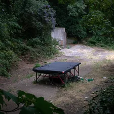 a table outside in the middle of a garden related to Elevate Your Camping Experience with Double Camping Beds