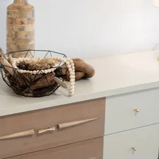 A table with a basket and a lamp on top of it related to Elevate Your Home Decor with Sideboard Buffet Furniture