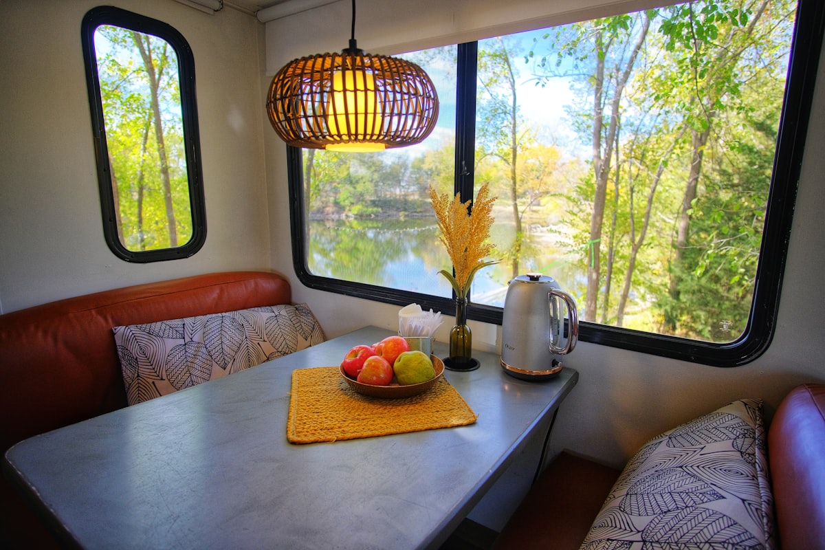 a table with a bowl of fruit on top of it related to Versatile Furniture Solutions for Your RV