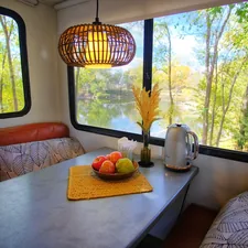 a table with a bowl of fruit on top of it related to Versatile Furniture Solutions for Your RV