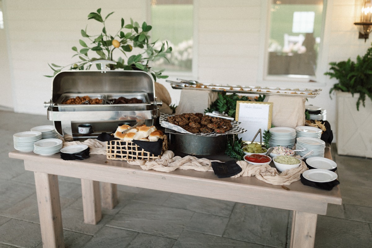 a table with a buffet of food on it related to Timeless Charm: Rustic Buffets and Sideboards for Your Home