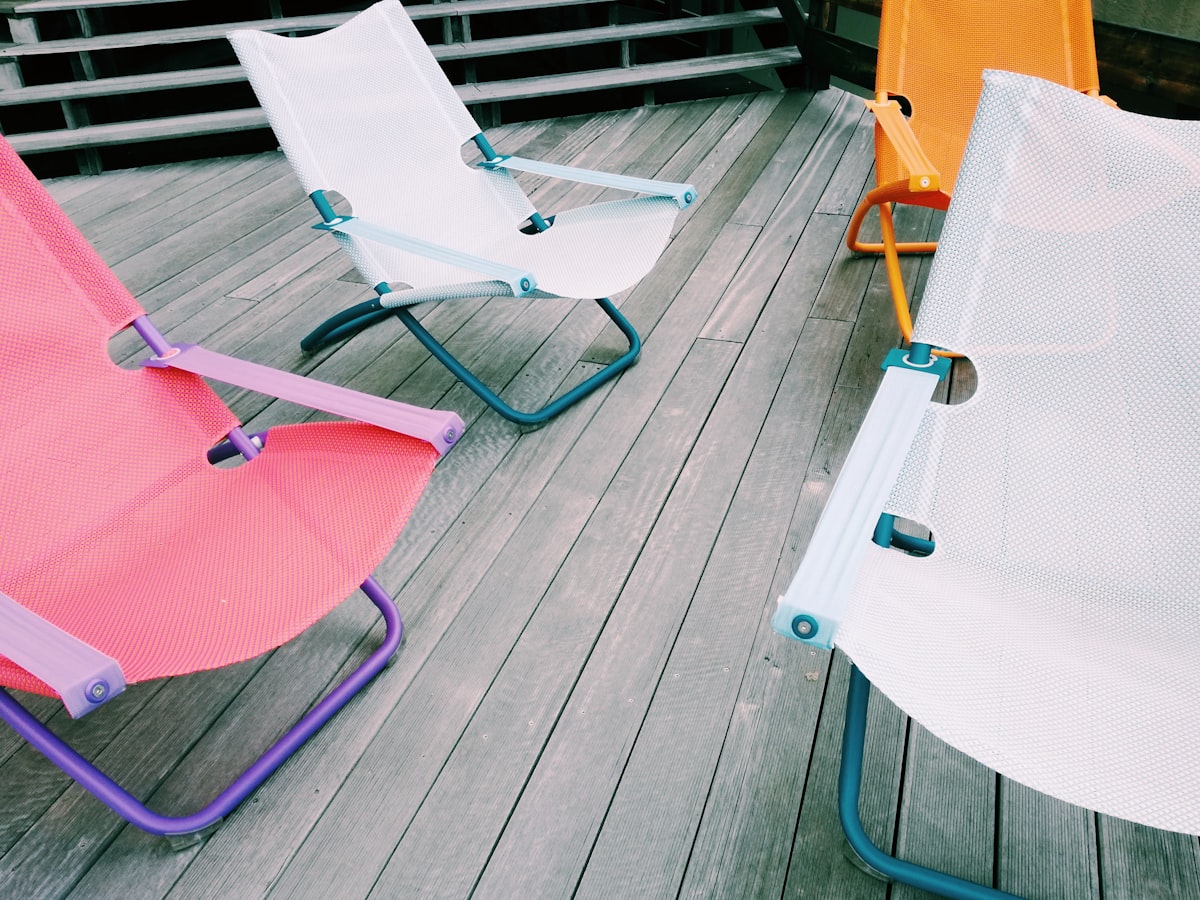 a table with a chair and a table with a chair and a table with a white tablecloth related to The Ultimate Sleeping Solution: Kids' Fold Out Chair Beds