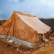 A tent sitting on top of a dirt field related to The Ultimate Guide to Choosing the Right Bed Bug Tent