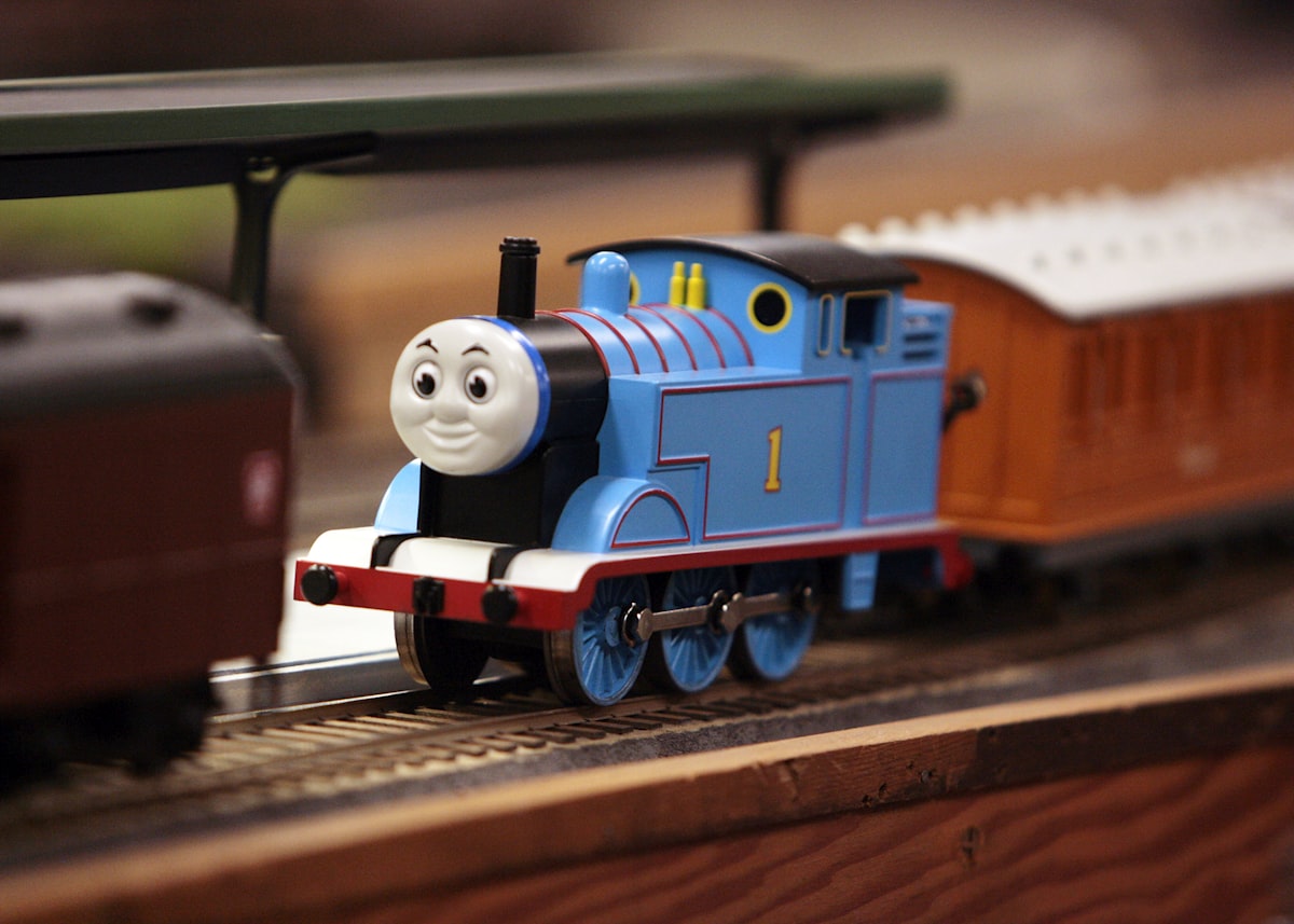 a toy thomas the tank engine on a track related to Chugging into Slumberland: Thomas the Train Toddler Bed Options