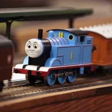 a toy thomas the tank engine on a track related to Chugging into Slumberland: Thomas the Train Toddler Bed Options