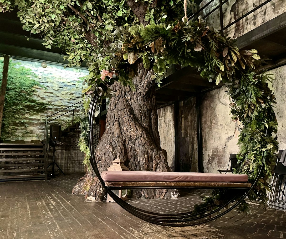 a tree with a bench related to The Bunk Bed Treehouse: A Childhood Dream Come True