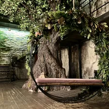 a tree with a bench related to The Bunk Bed Treehouse: A Childhood Dream Come True