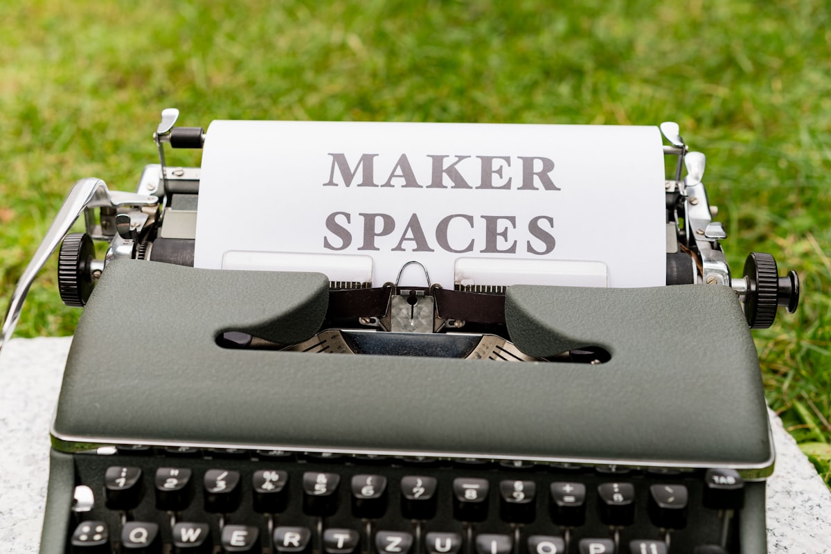 a typewriter with a piece of paper that says maker spaces related to Maximizing Space: The Benefits of Double Bunk Beds from IKEA