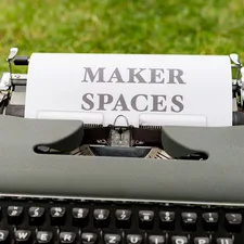 a typewriter with a piece of paper that says maker spaces related to Maximizing Space: The Benefits of Double Bunk Beds from IKEA