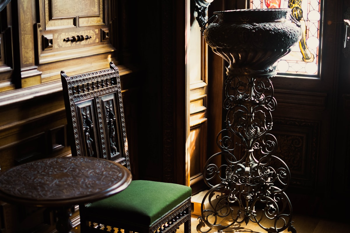 a vase and chair in a room related to Masterpiece Cast Iron Chimineas at Home Depot