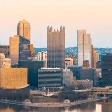A view of a city with a bridge in the foreground related to Transform Your Bedroom with Pittsburgh Pirates Bedding