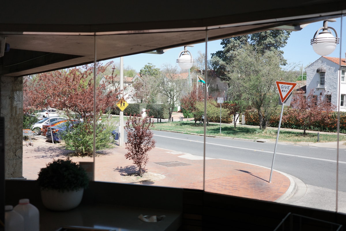 a view of a street through a window related to Custom Valances for Windows: Elevate Your Home's Style