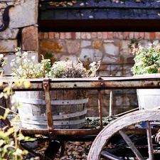 a wagon filled with lots of potted plants related to Country Swags and Valances