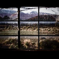 a window with a view of a mountain range related to The Art of Window Valances: Exploring Cornice Window Valance Options