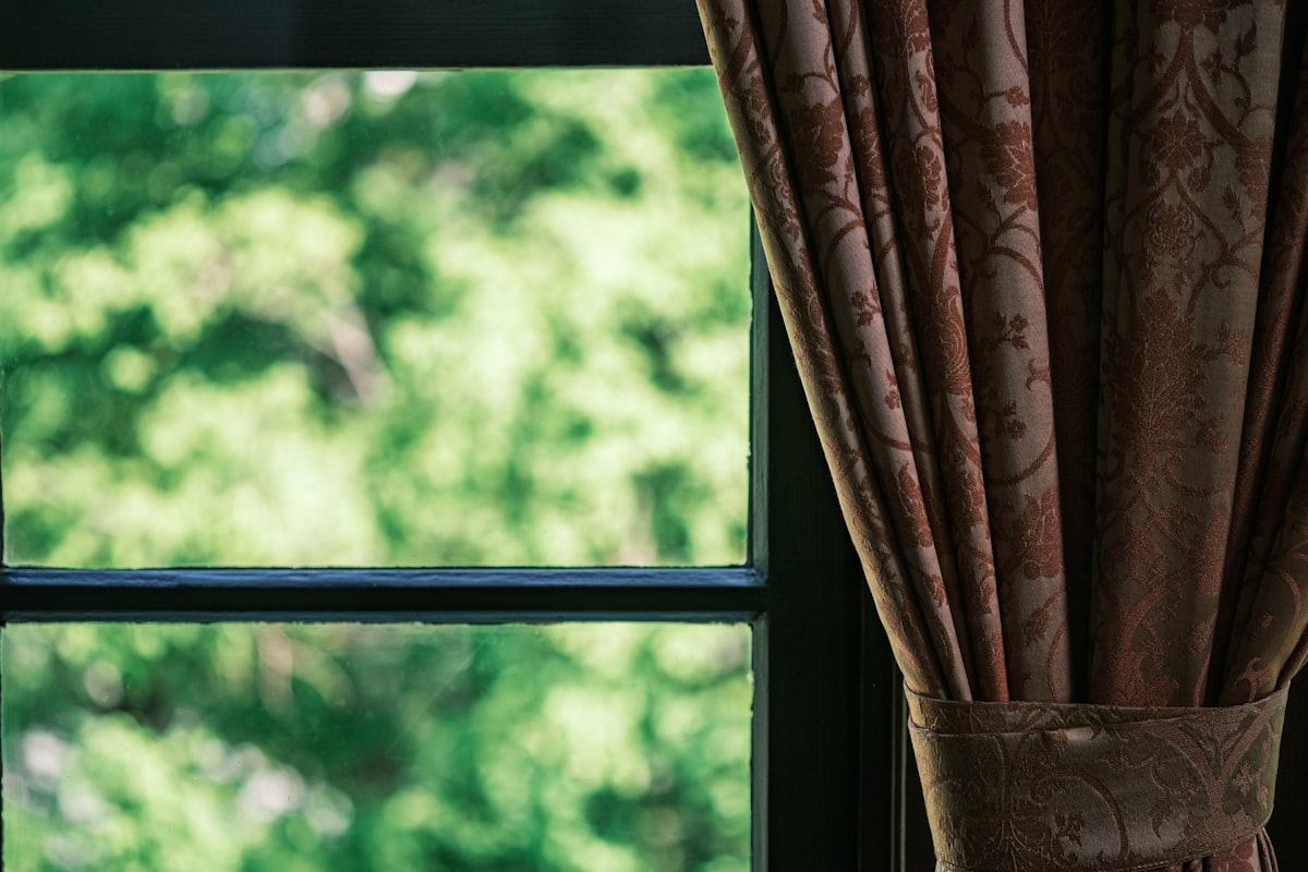 a window with curtains related to Elevate Your Windows with Curtain Swags and Valances