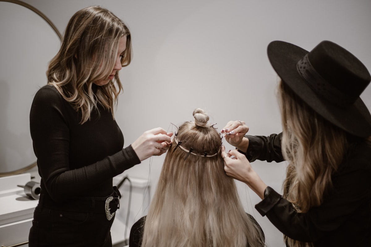 a woman getting her hair styled by another woman related to Level Up Your Style with Stunning Valence Scarf Ideas