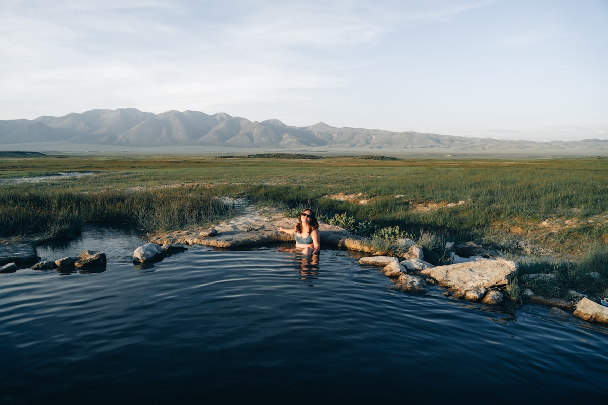 a woman standing in a body of water related to Discover the Bliss of Bed and Breakfast Hot Springs AR