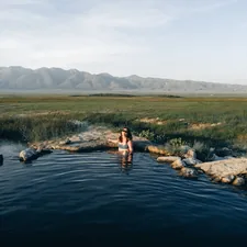 a woman standing in a body of water related to Discover the Bliss of Bed and Breakfast Hot Springs AR