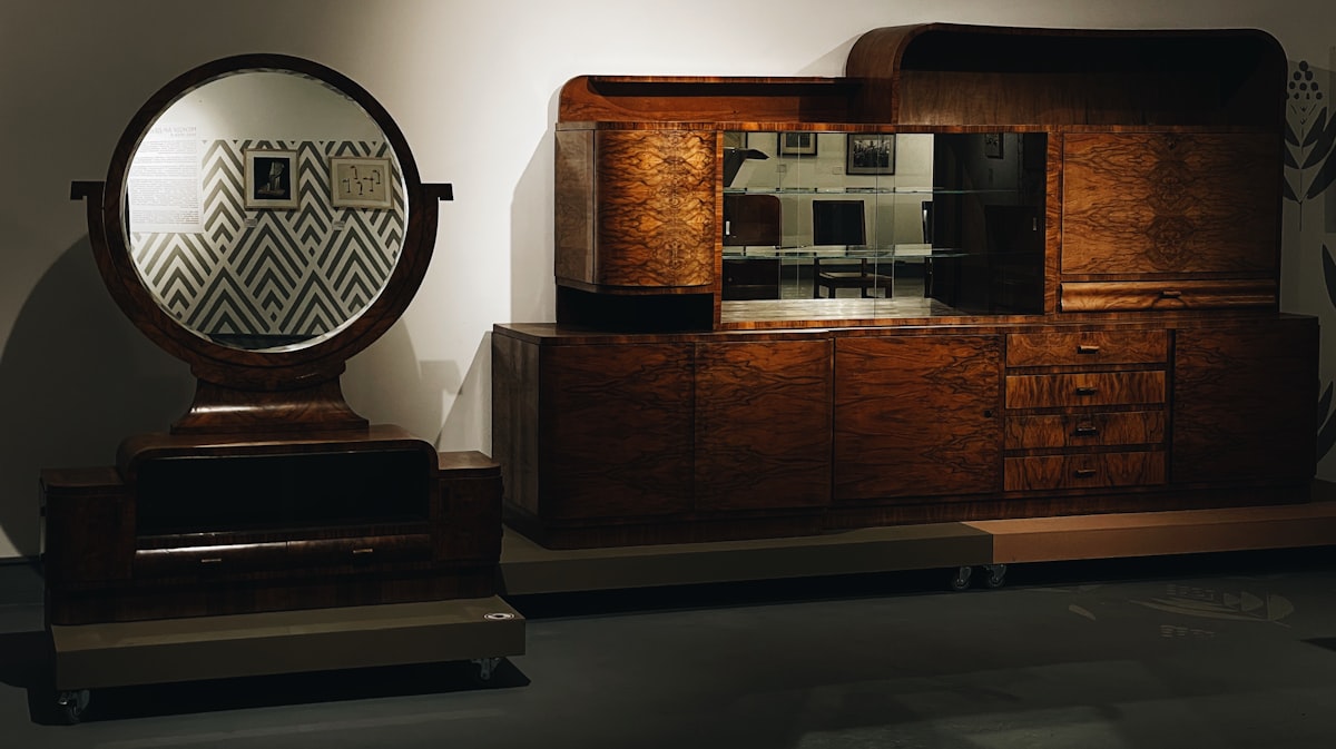 a wooden dresser with a mirror on top of it related to Elevate Your Home with Modern Sideboards & Buffets
